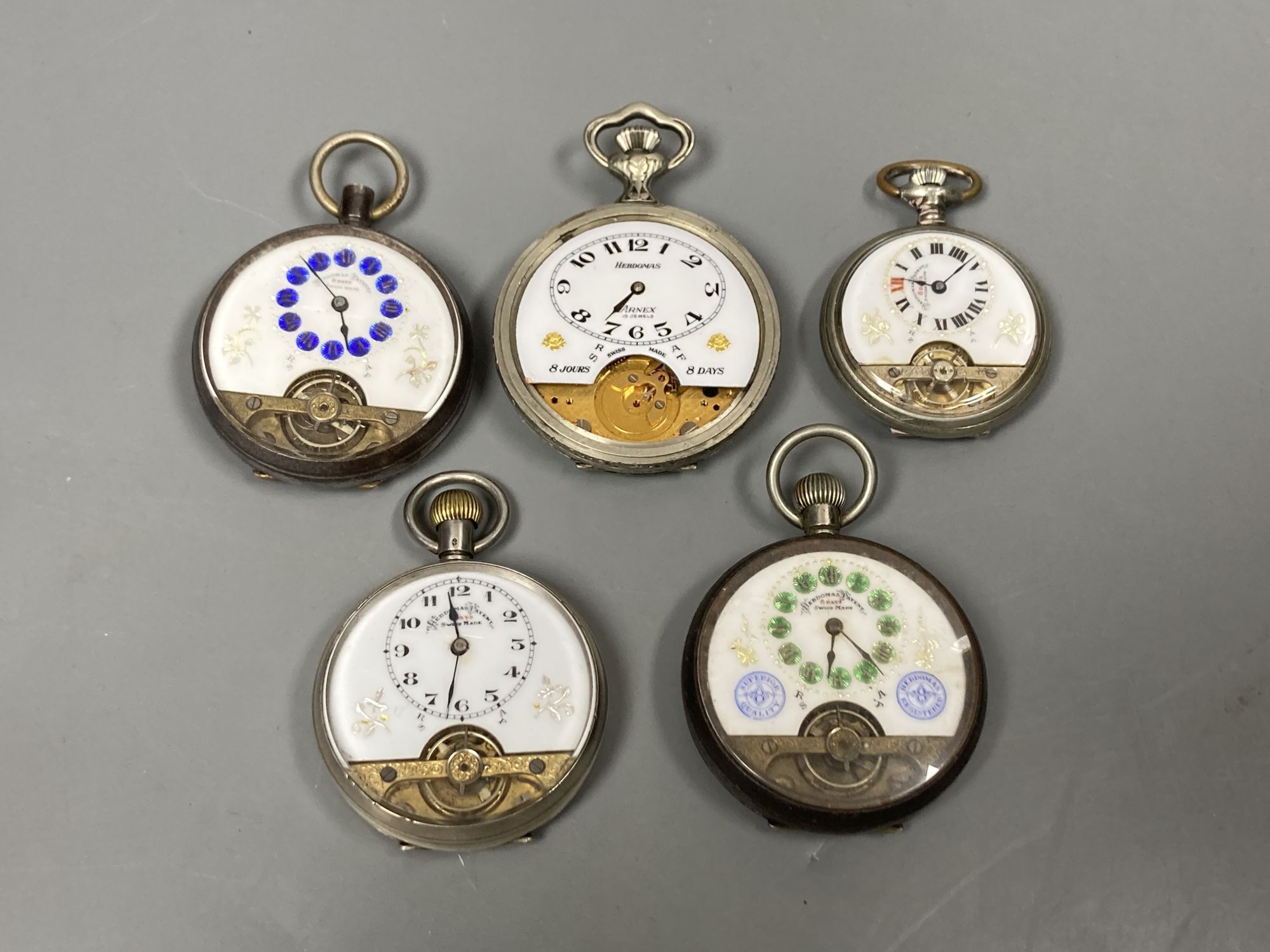 Four assorted base metal Hebdomas pocket watches and a silver Hebdomas pocket watch